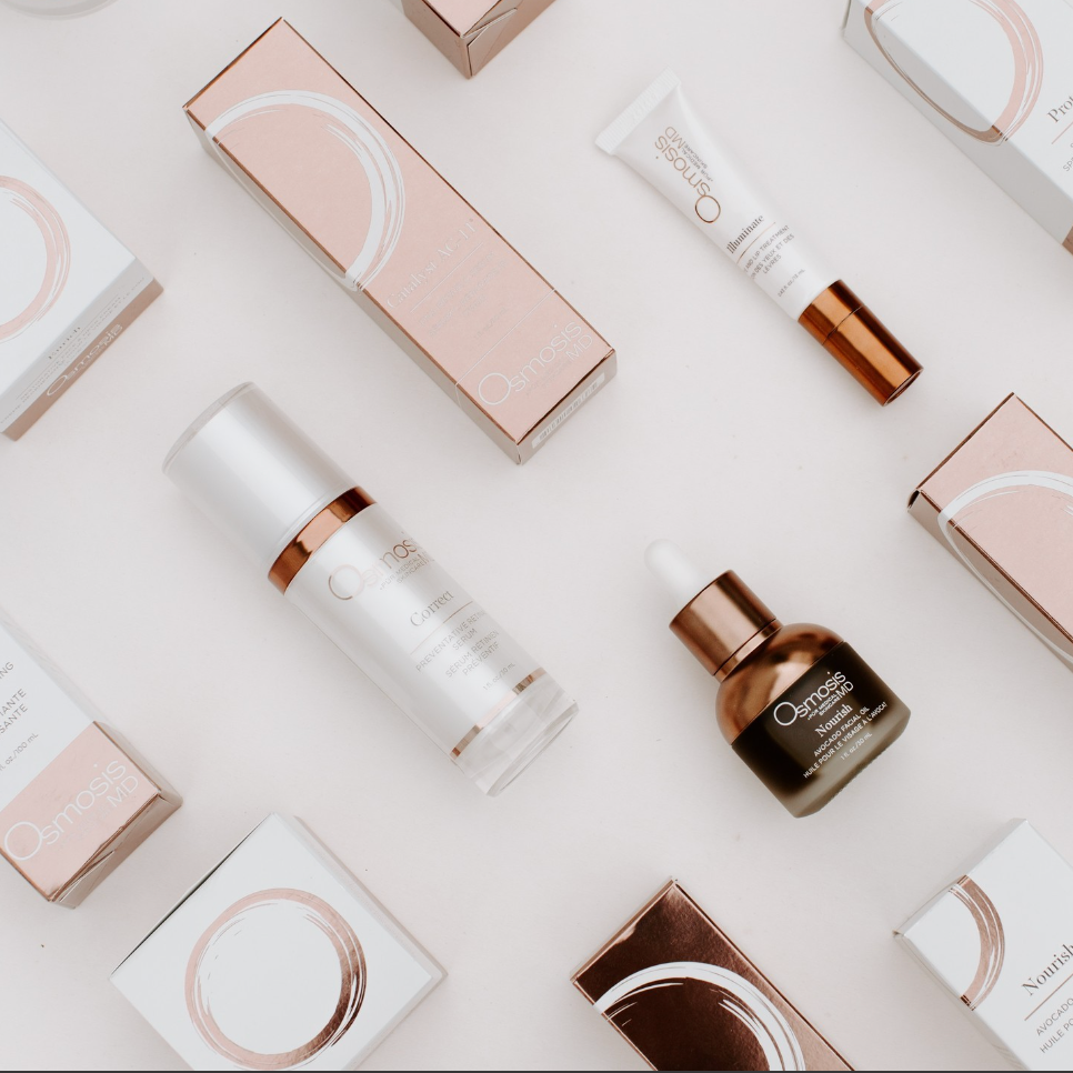 Skincare products and boxes arranged on a light background